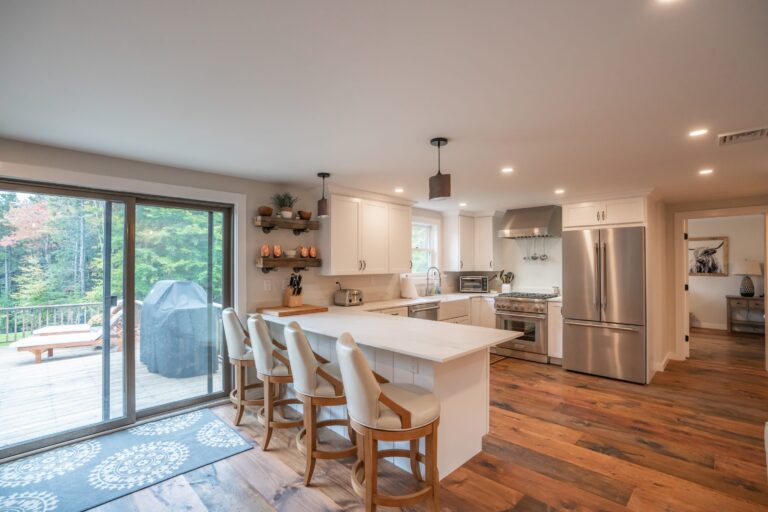 Fully stocked kitchen with coffee bar and breakfast stools