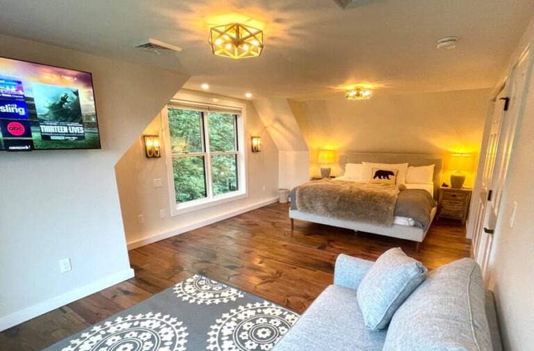Private upper west wing bedroom with king sized bed and views of the pond